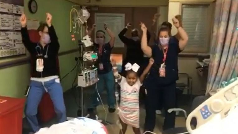 Little girl dances with hospital staff after undergoing three open heart surgeries